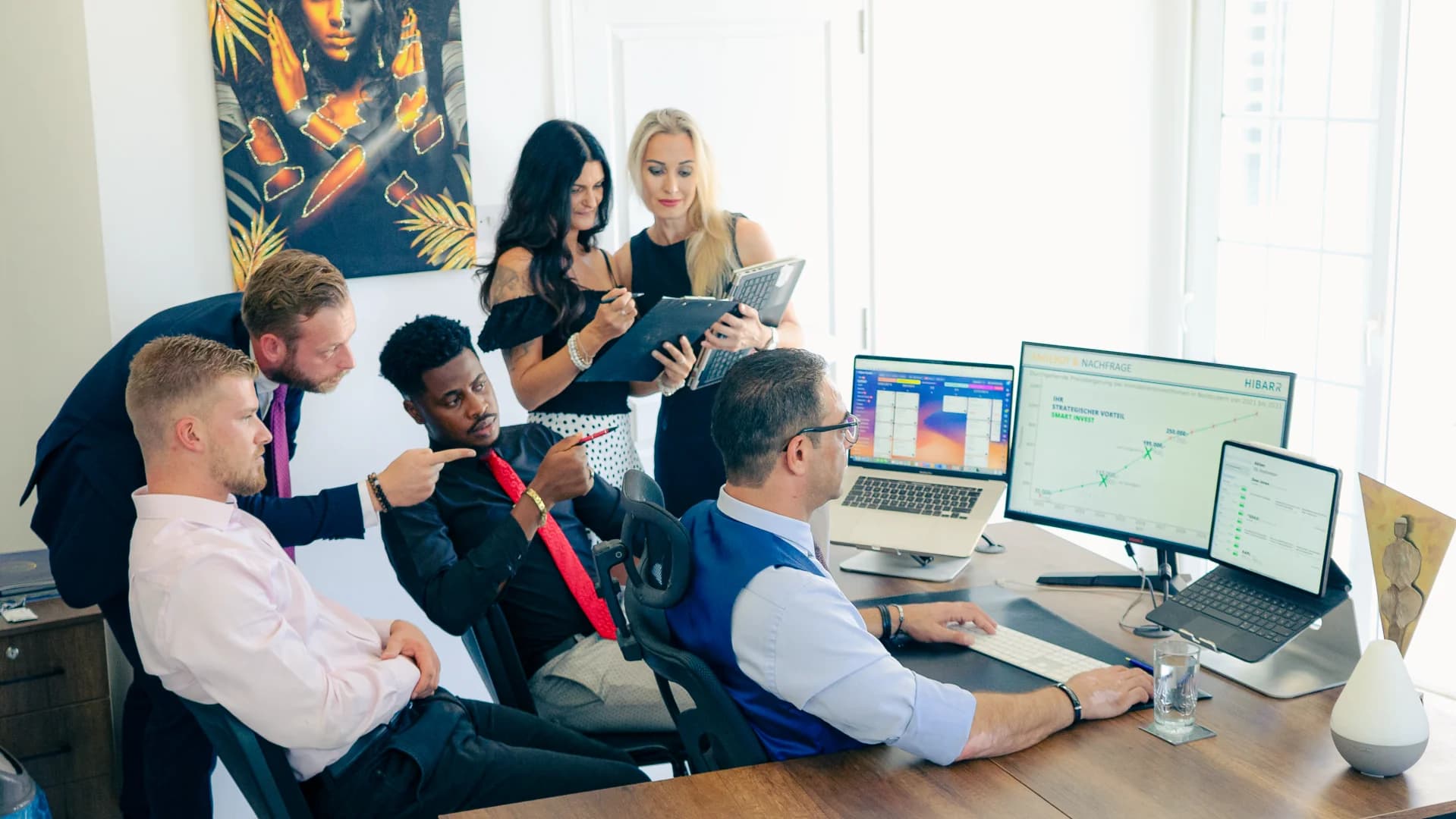 Team collaborating on analytics dashboards in the office