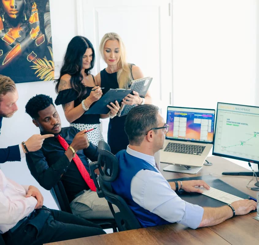 Team collaborating while reviewing analytics dashboards