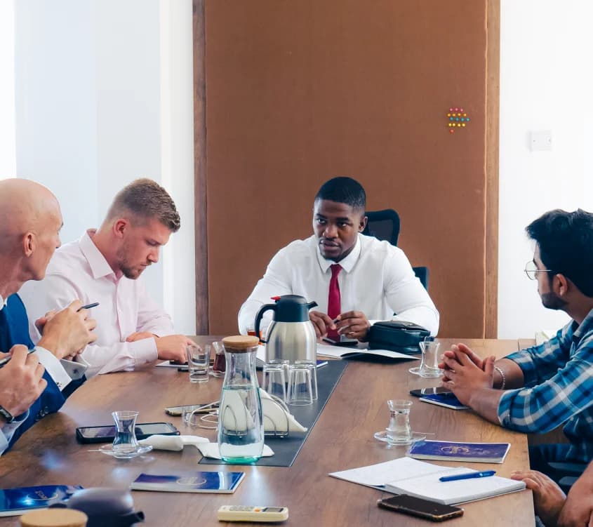 Hibarr team meeting in a boardroom, discussing company vision